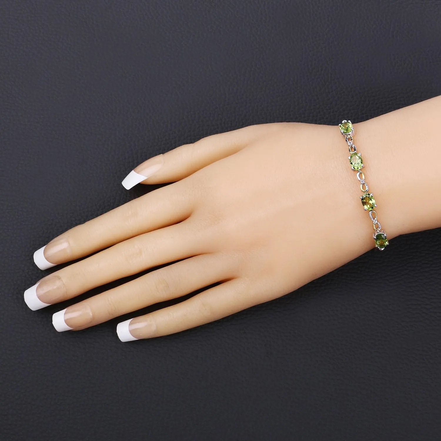 Oval Green Peridot Prong Two-Tone Gold Plated Silver Infinity Bolo Adjustable Bracelet sold by Zulily product image thumbnail 2