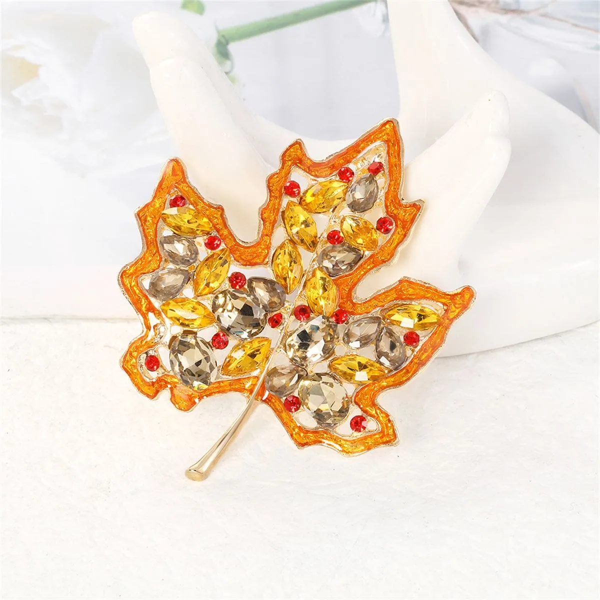Yellow Crystal & Red Cubic Zirconia Maple Brooch sold by Zulily