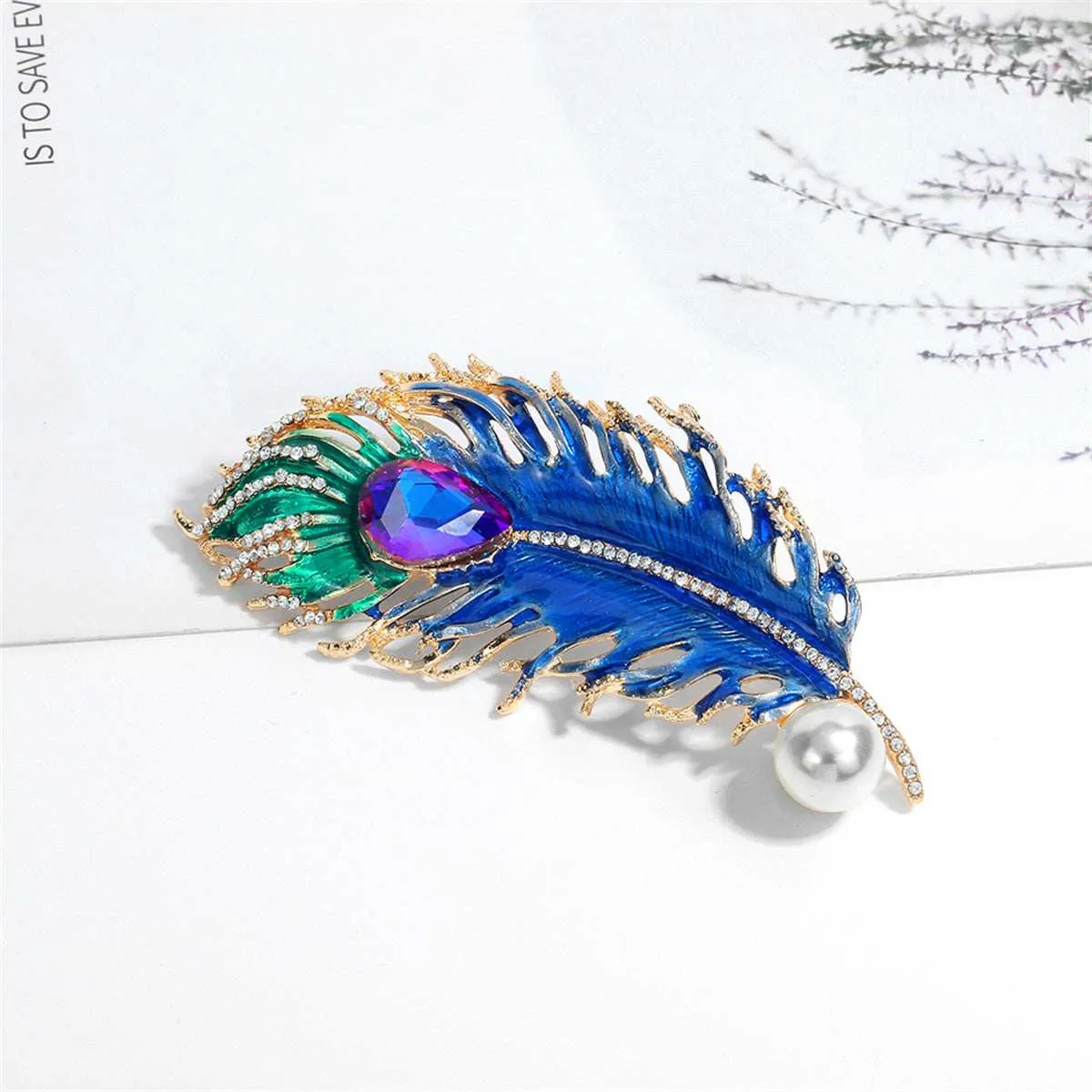 Blue Crystal & Cubic Zirconia Feather Brooch sold by Zulily