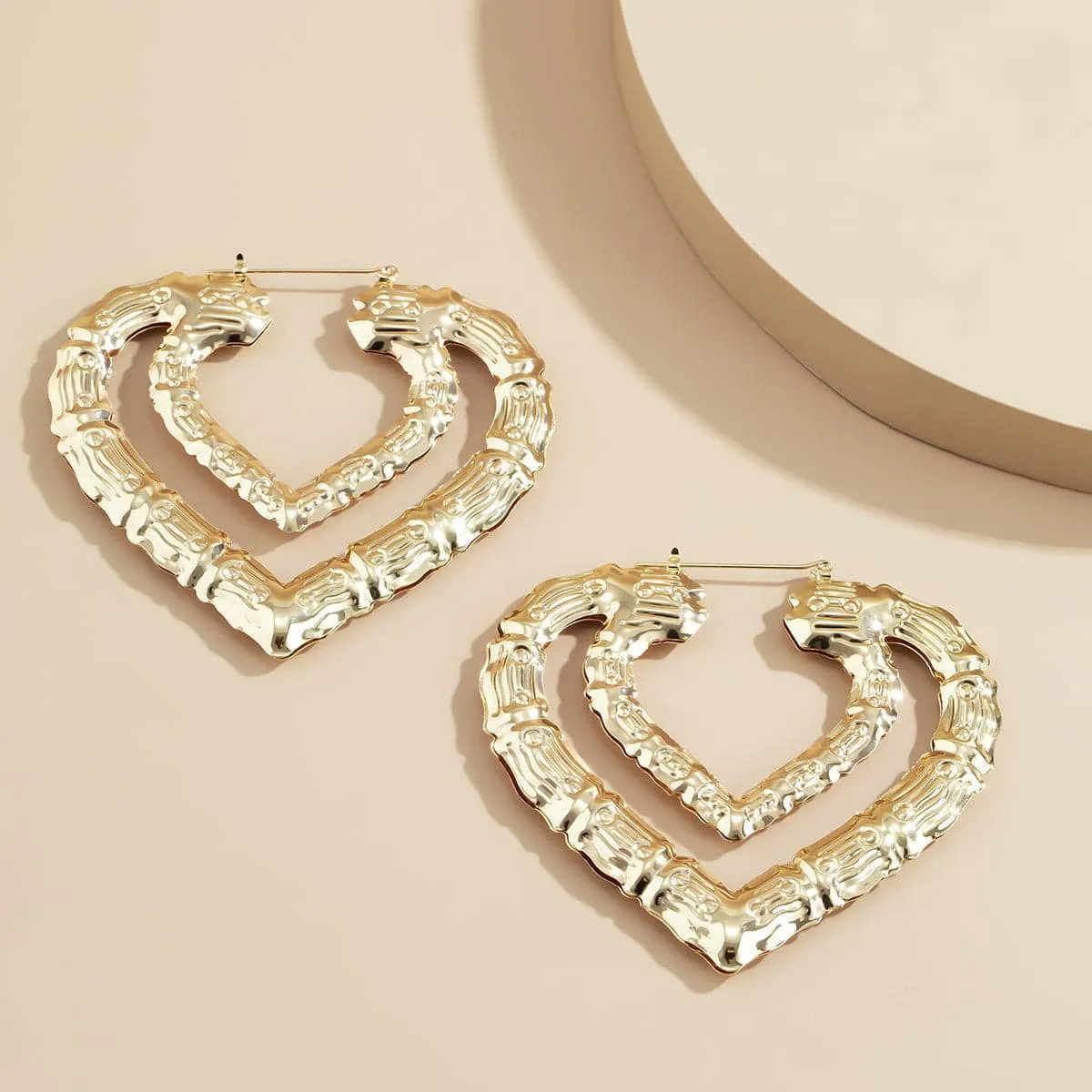 Goldtone Bamboo Layered Heart Hoop Earrings sold by Zulily