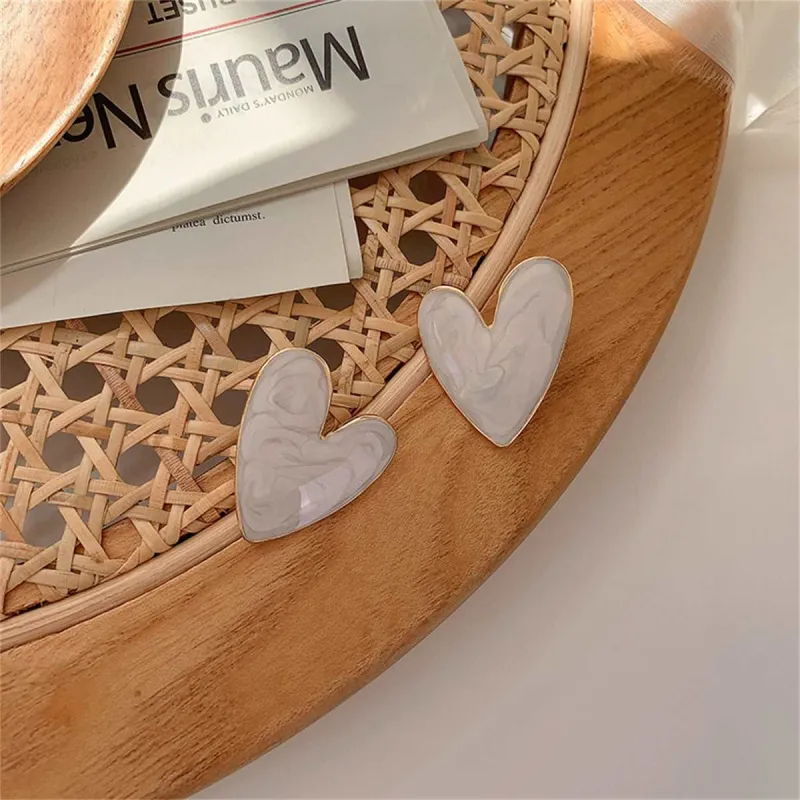 Ivory Enamel & Goldtone Heart Stud Earrings made by Zulily