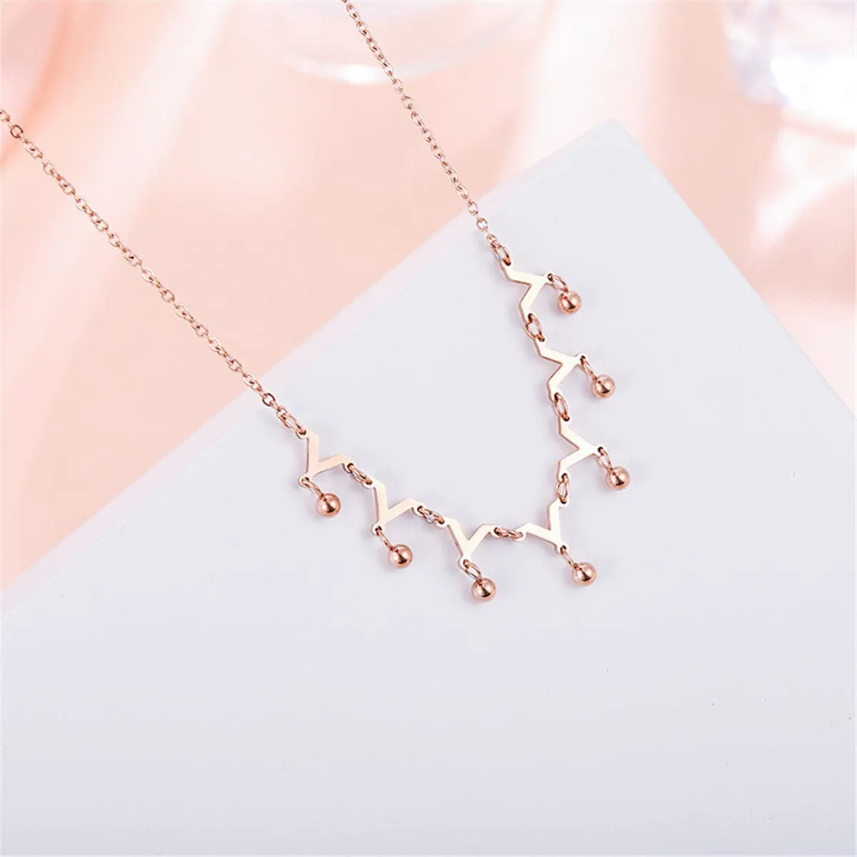 Rose Goldtone Letter V & Bead Necklace sold by Zulily
