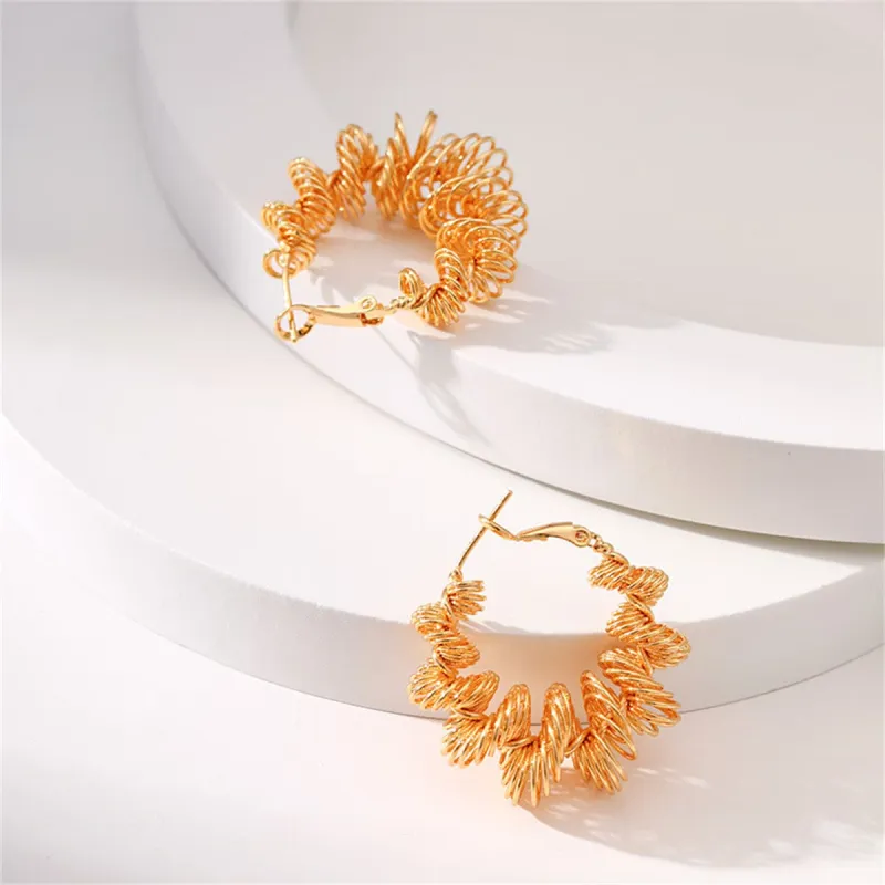 Goldtone Twisted Huggie Earrings made by Zulily