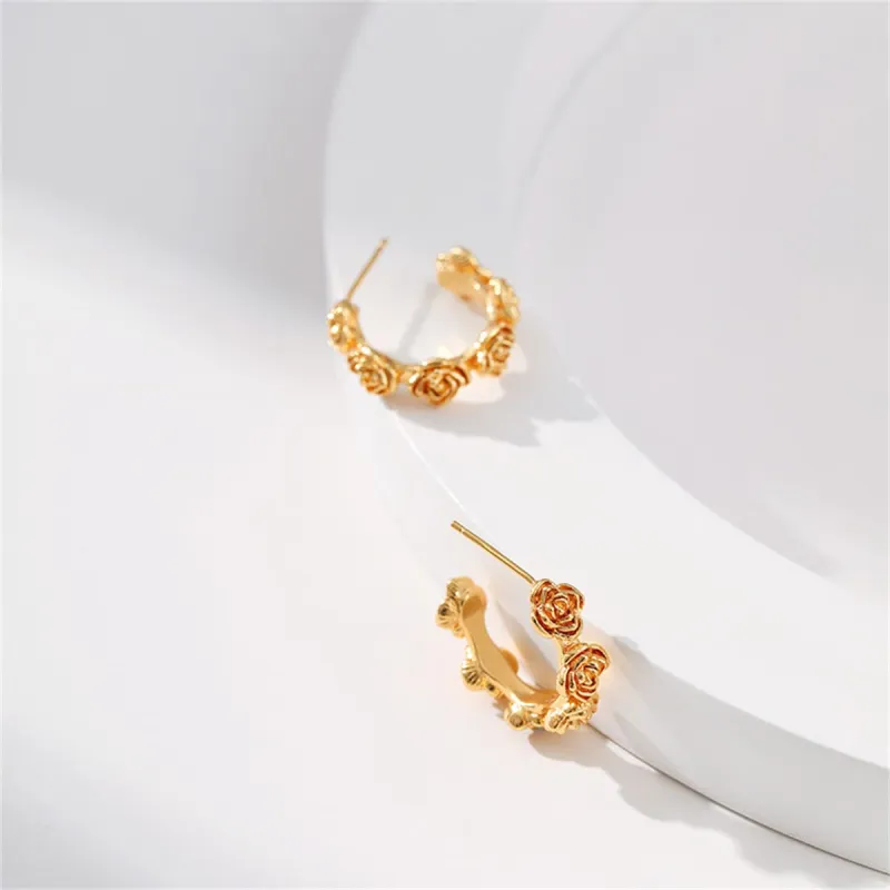Goldtone Rose Huggie Earrings made by Zulily