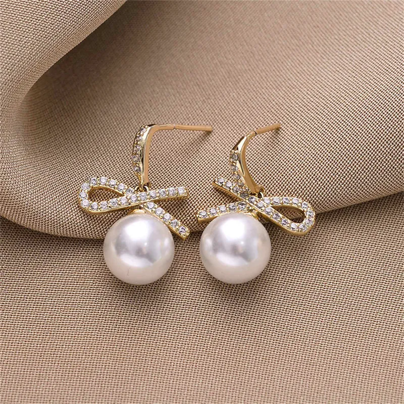 White Cubic Zirconia & Pearl Goldtone Bow Drop Earrings made by Zulily