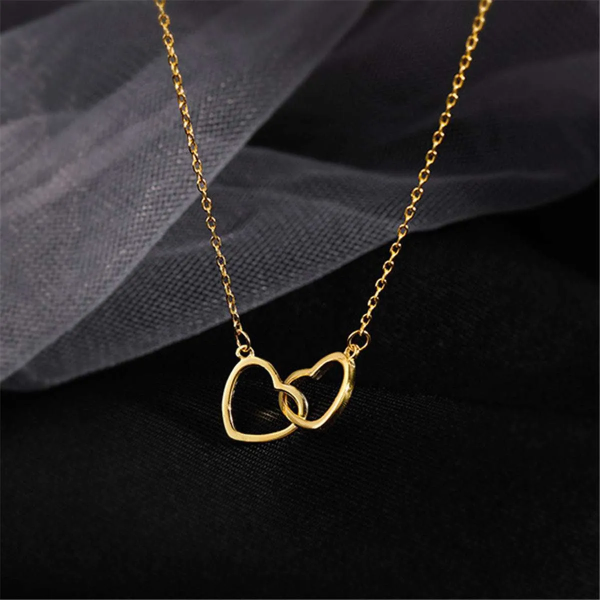 Goldtone Interlocking Heart Pendant Necklace sold by Zulily product image thumbnail 3