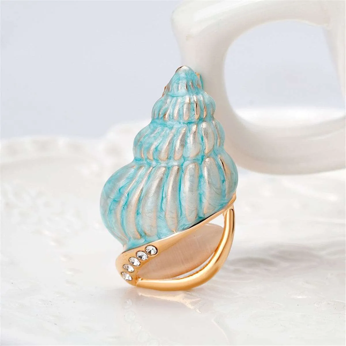 Cubic Zirconia & Goldtone Conch Brooch sold by Zulily