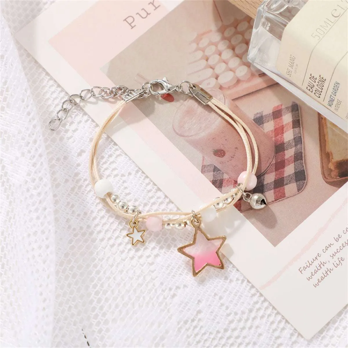 Pink Enamel & Two-Tone Star Layered Charm Bracelet sold by Zulily