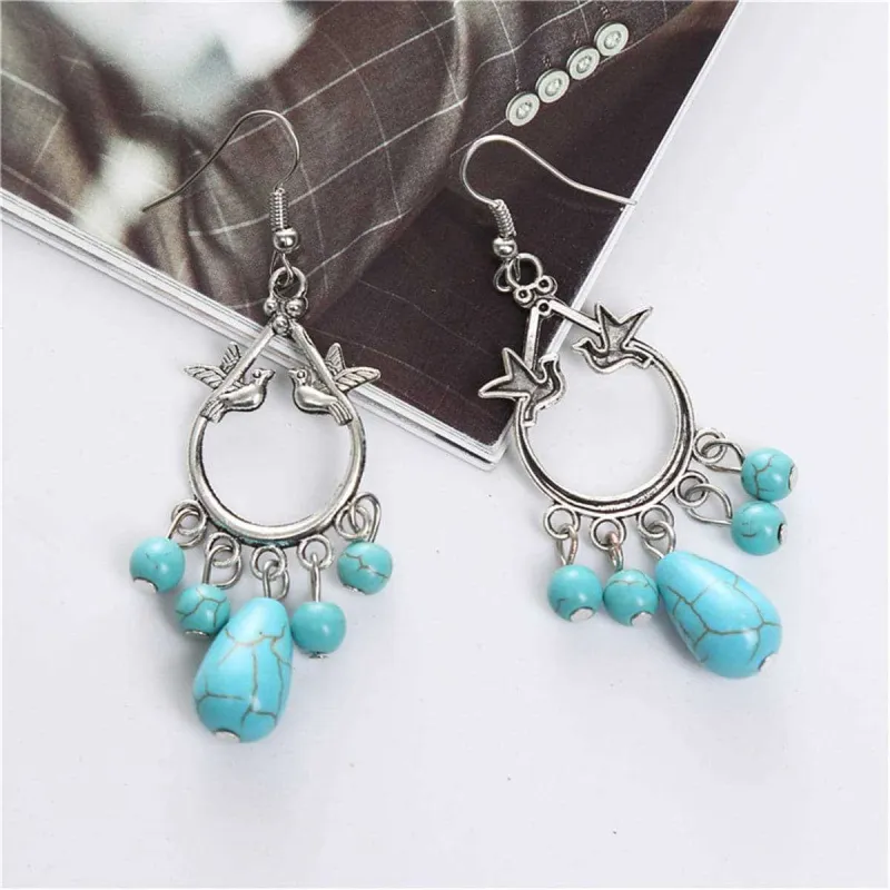 Turquoise & Silvertone Bird Teardrop Earrings made by Zulily