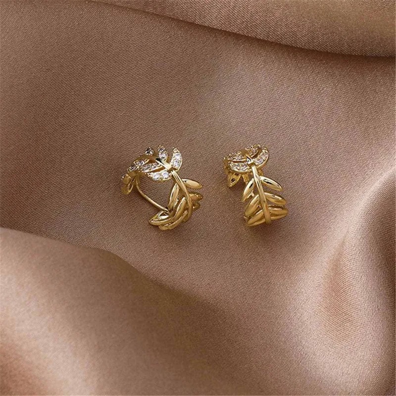 Cubic Zirconia & Goldtone Leaf Huggie Earrings made by Zulily