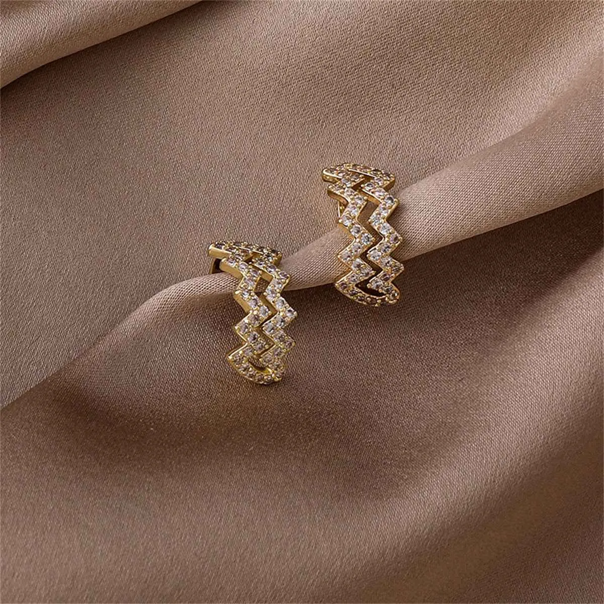 Cubic Zirconia & Goldtone Wave Ear Cuffs sold by Zulily