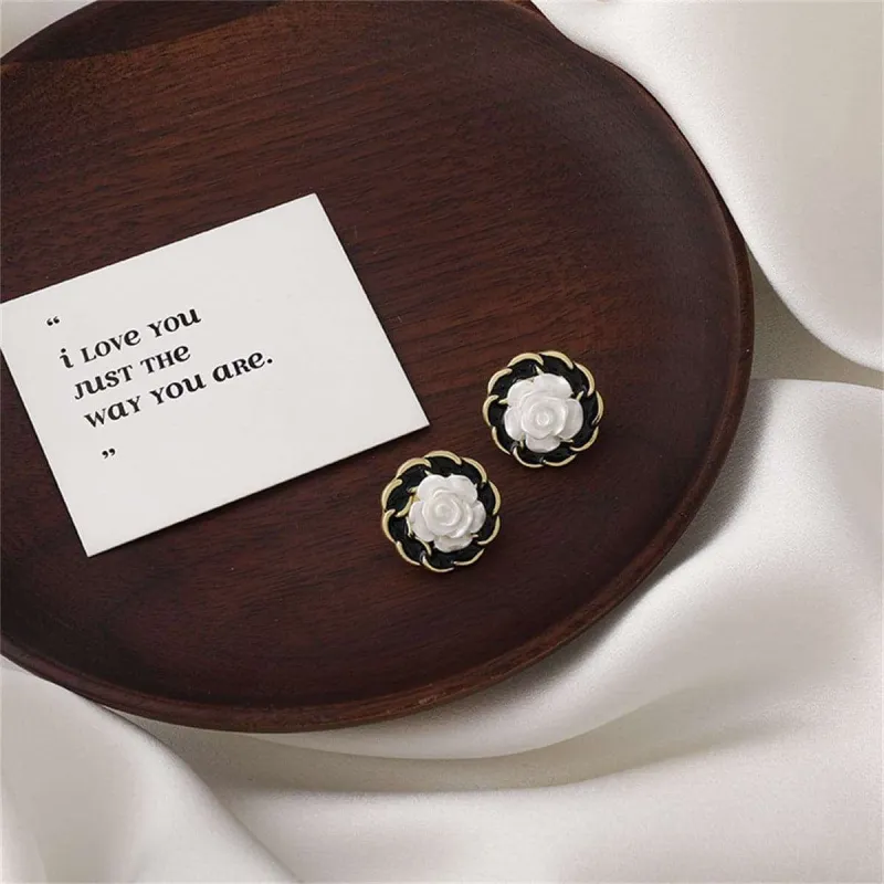 White Resin & Black Enamel Goldtone Camellia Stud Earrings made by Zulily