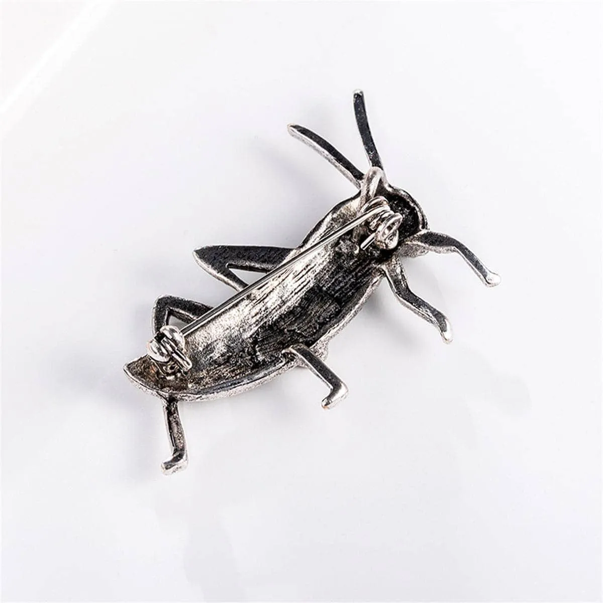 Cubic Zirconia & Silvertone Locust Brooch sold by Zulily
