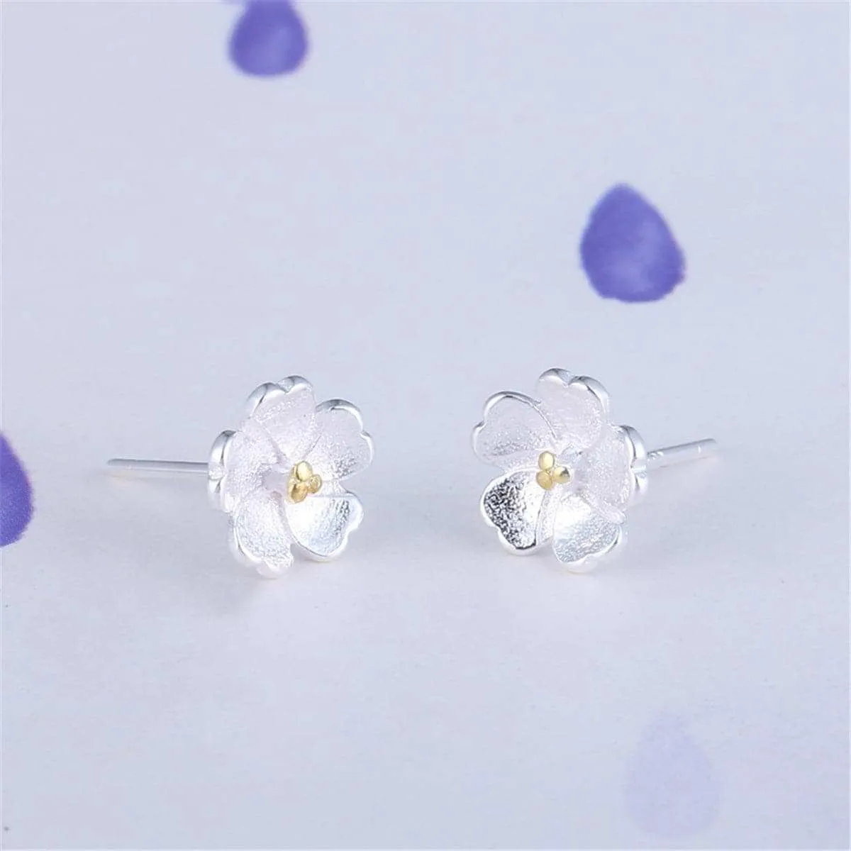 Two-tone Sakura Floral Stud Earrings sold by Zulily