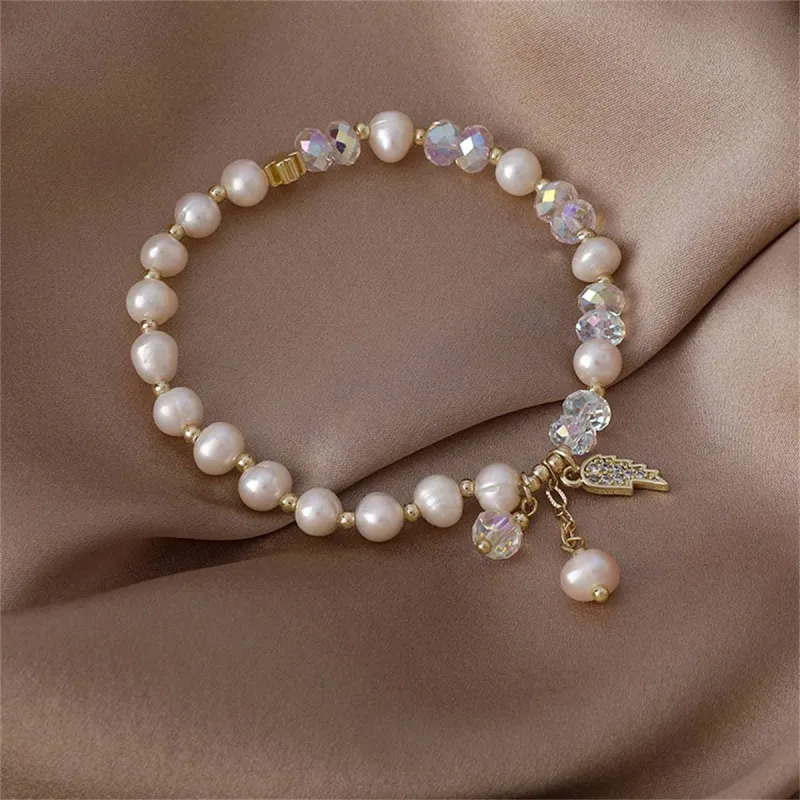 Pearl & Cubic Zirconia Goldtone Wing Charm Stretch Bracelet made by Zulily