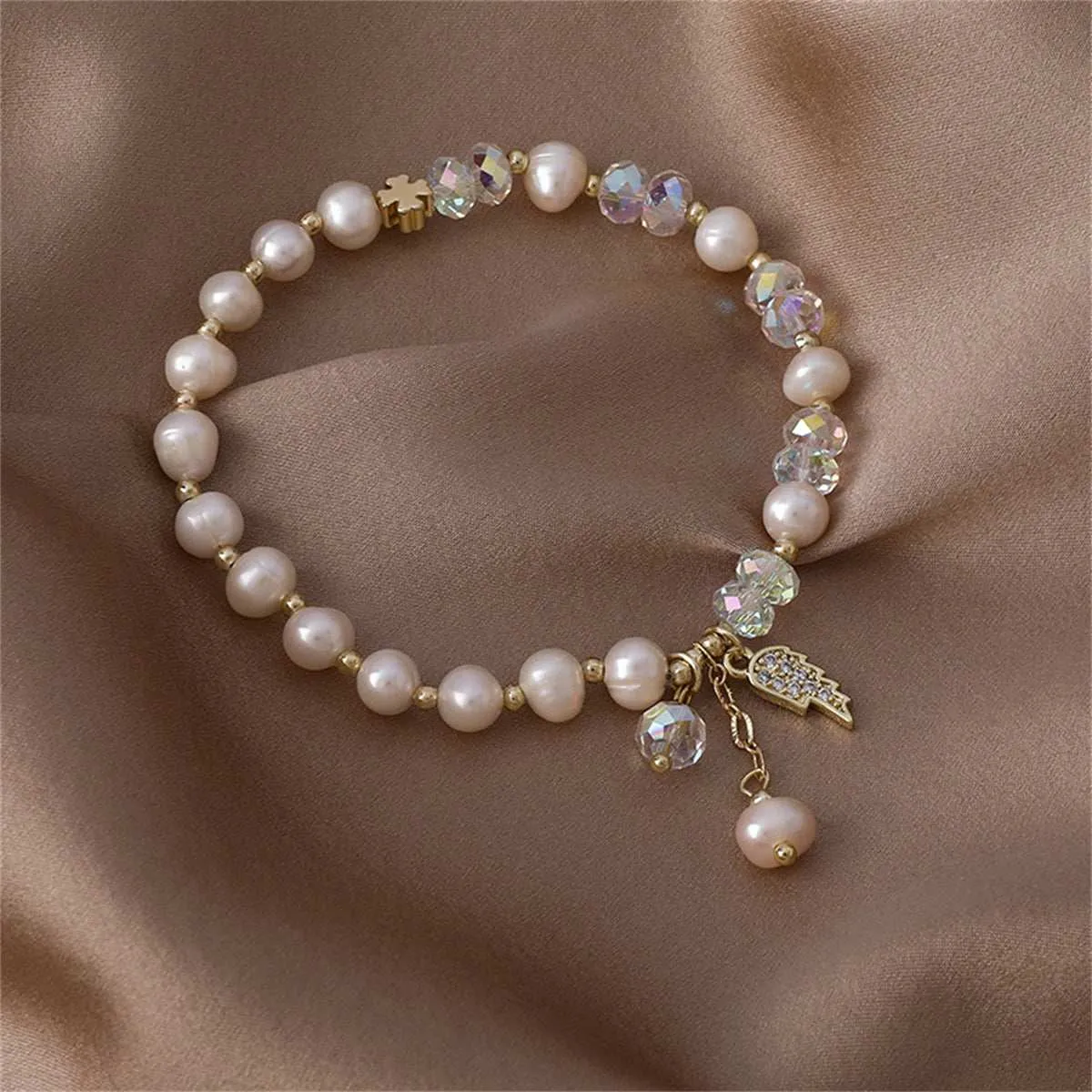 Pearl & Cubic Zirconia Goldtone Wing Charm Stretch Bracelet sold by Zulily product image thumbnail 2