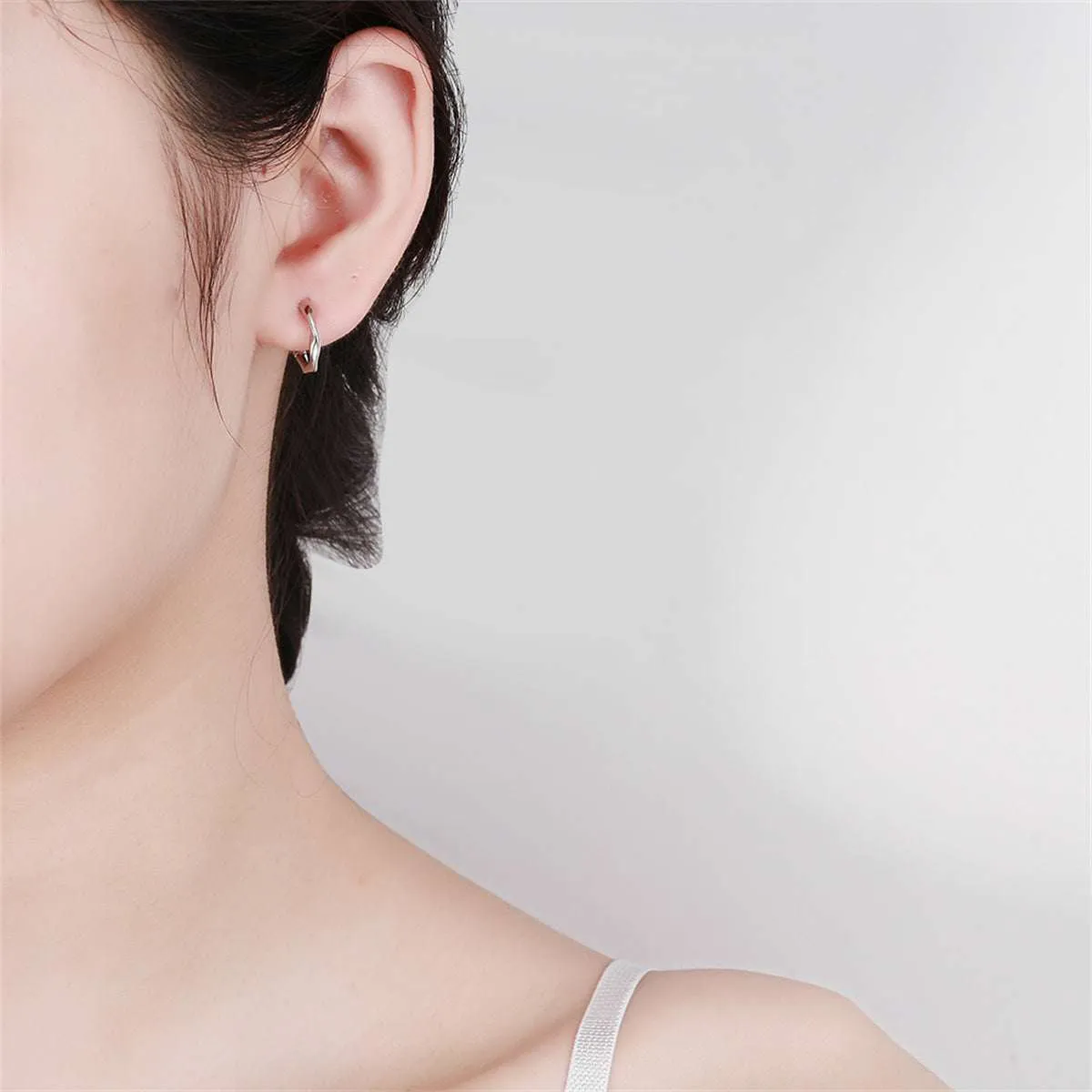 Silvertone Wave Huggie Earring sold by Zulily product image thumbnail 3