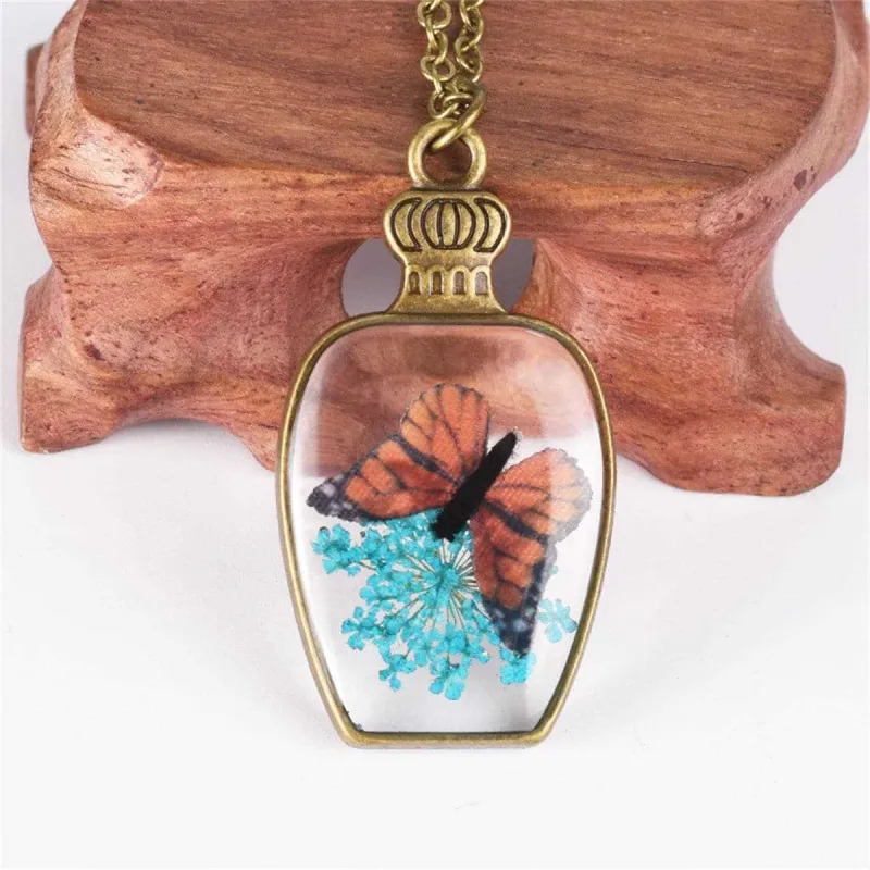 Dark Blue Gypsophila & Goldtone Butterfly Vase Pendant Necklace made by Zulily