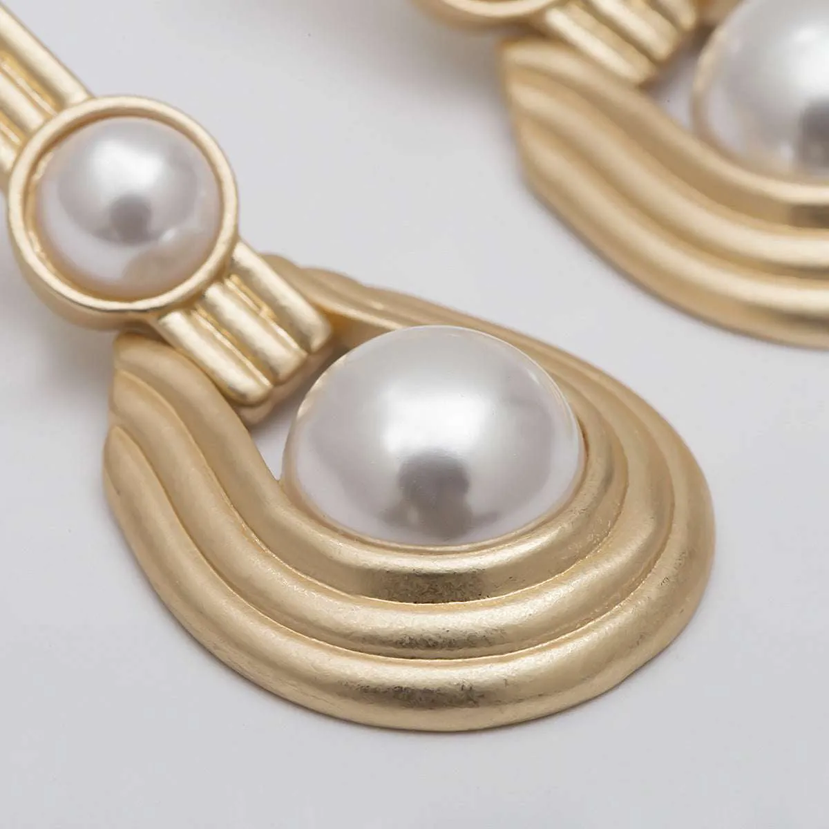 Pearl & Goldtone Textured Oval Drop Earrings sold by Zulily