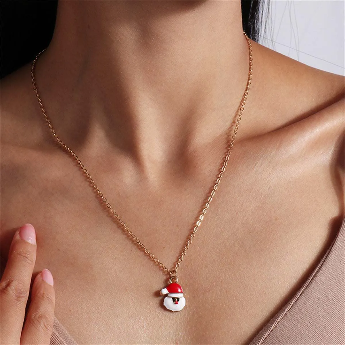 Red Enamel & Goldtone Santa Pendant Necklace sold by Zulily