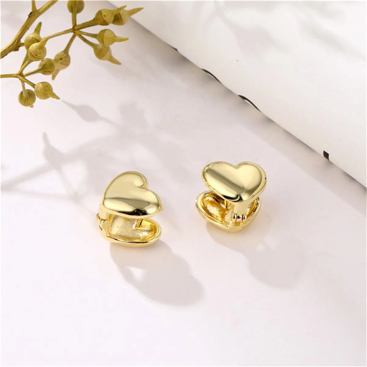 Goldtone Heart Huggie Earrings sold by Zulily product image thumbnail 5