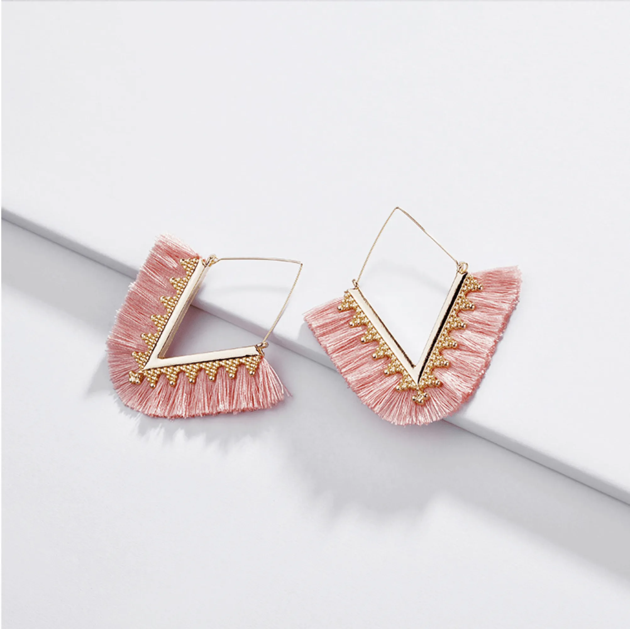 Goldtone Pink Tassel Triangle Drop Earrings sold by Zulily
