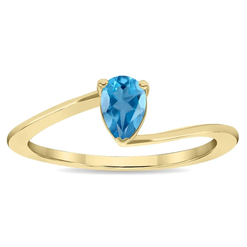 Women's Solitaire Pear Shaped Blue Topaz Wave Ring in 10K Yellow Gold sold by Zulily