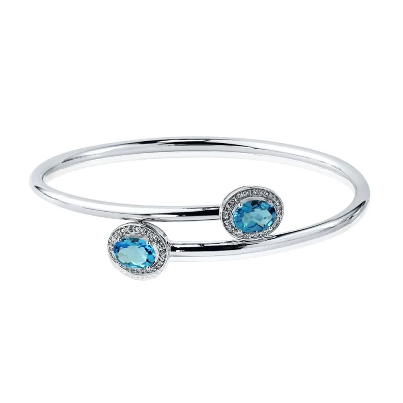 Auriya 2 1/2ct Oval Swiss-Blue Topaz Gold over Silver Bangle Bracelet with Diamond Accents sold by Zulily