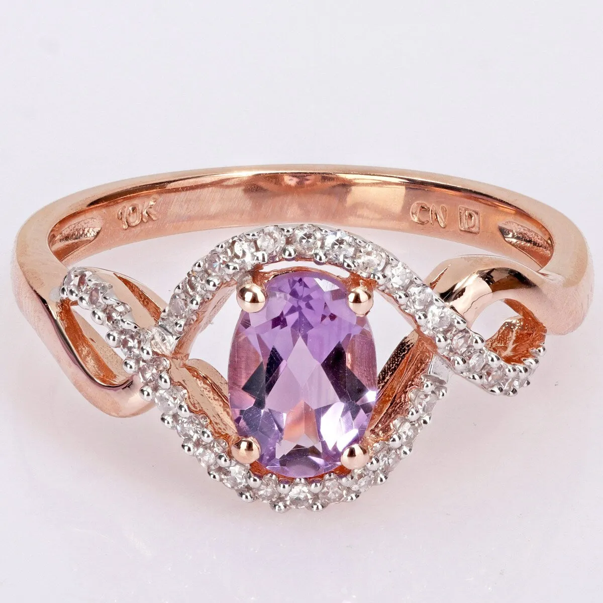 Miadora 10k Rose Gold Amethyst and 1/6ct TDW Diamond Halo Infinity Ring sold by Zulily