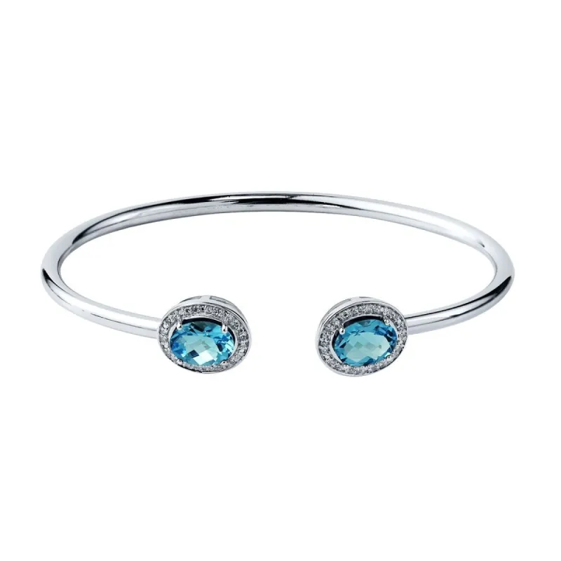 Auriya 2 1/2ct Oval Swiss Blue Topaz Gold over Silver Bangle Bracelet with Diamond Accents sold by Zulily