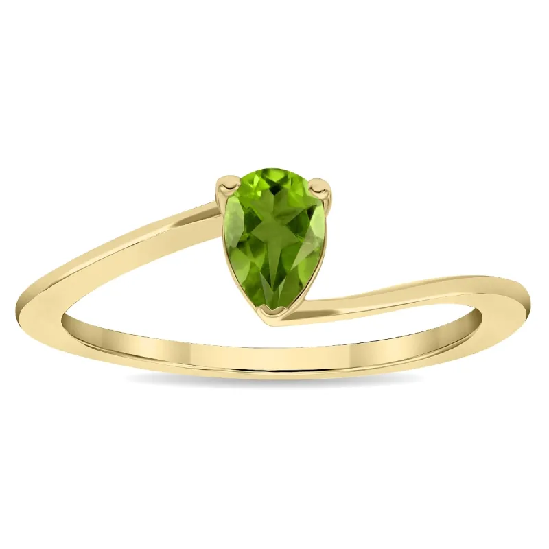 Women's Solitaire Pear Shaped Peridot Wave Ring in 10K Yellow Gold sold by Zulily