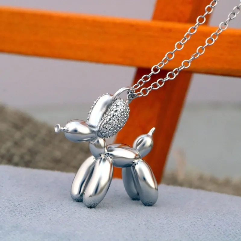 Sterling Silver 1/10ct Diamond Charm Animal Pendant- Dog and Elephant sold by Zulily