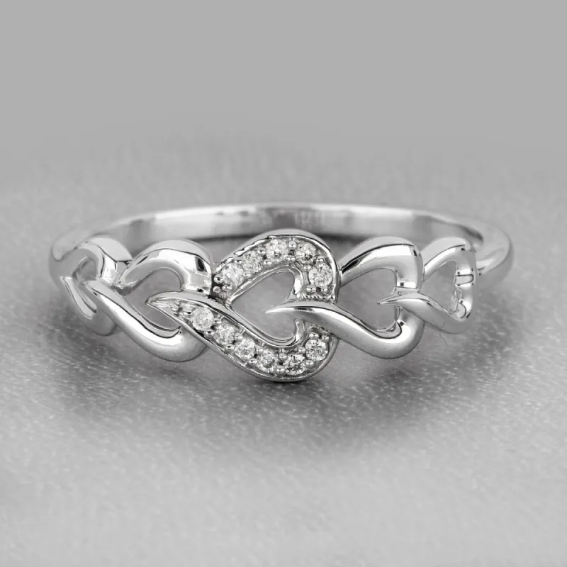 De Couer 10k White Gold 1/20ct TDW Diamond Connecting Heart Ring sold by Zulily