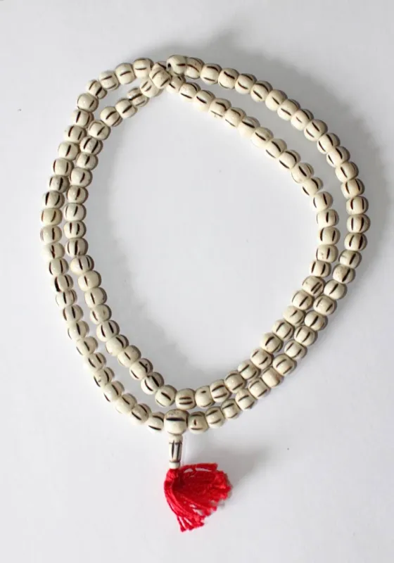 Carved Bone Mala- Light Striped made by Haystacks