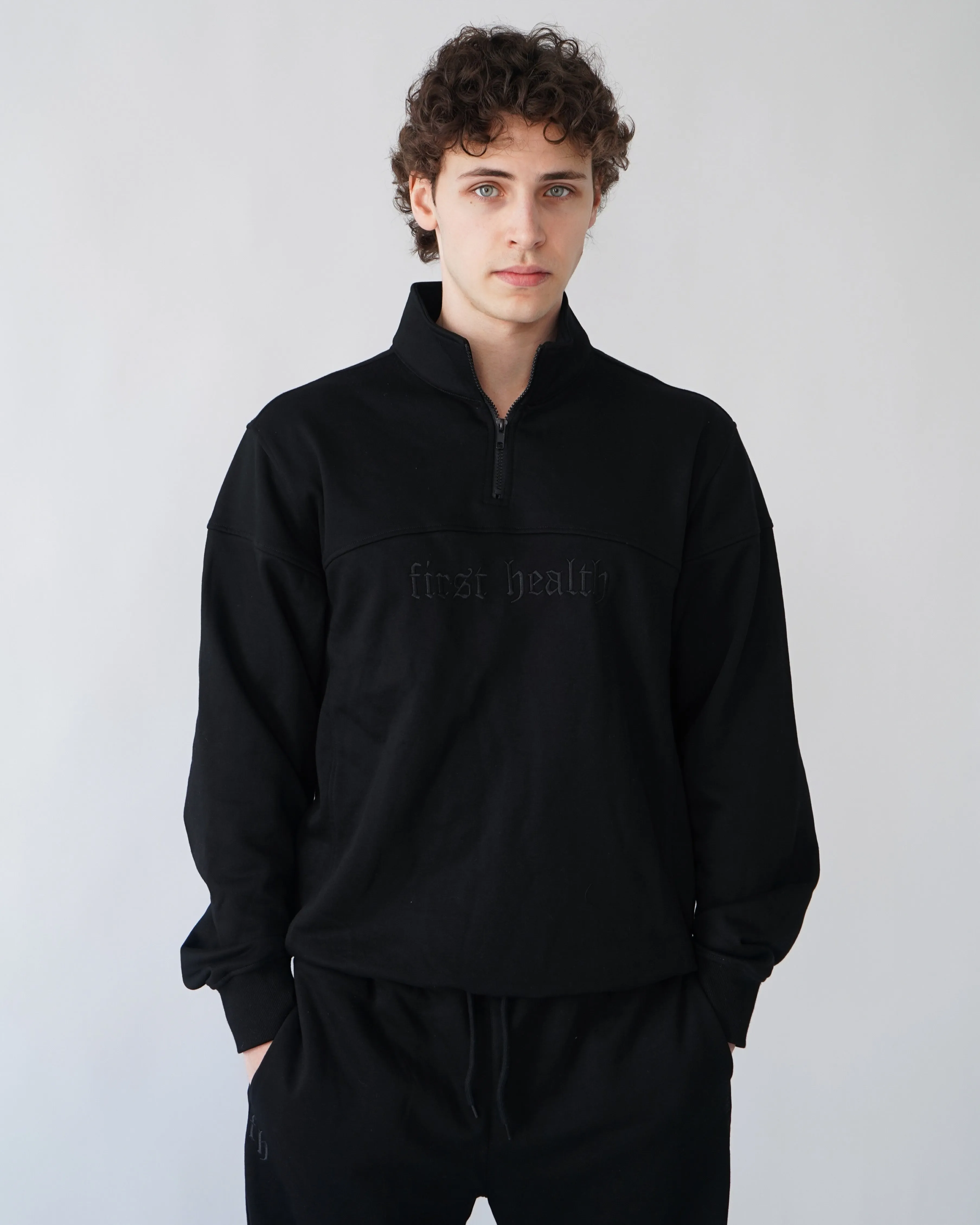 Essential Quarter Zip - Black sold by First Health Apparel