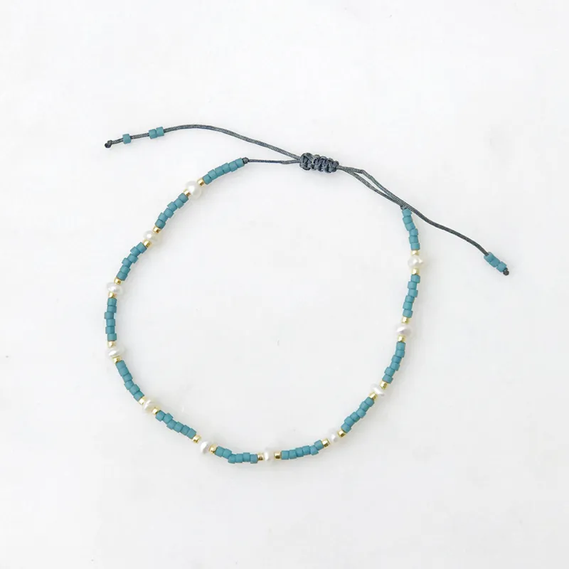 Spaced Pearl Pull Tie Bracelet Dusty Blue made by Sand Dollar