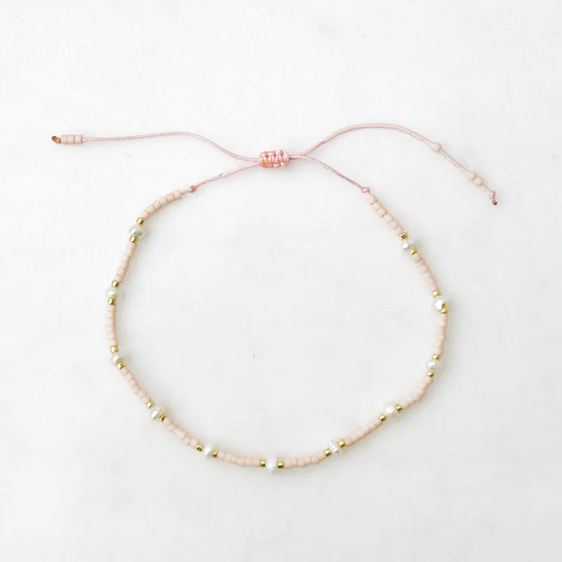 Spaced Pearl Pull Tie Bracelet Pink made by Sand Dollar