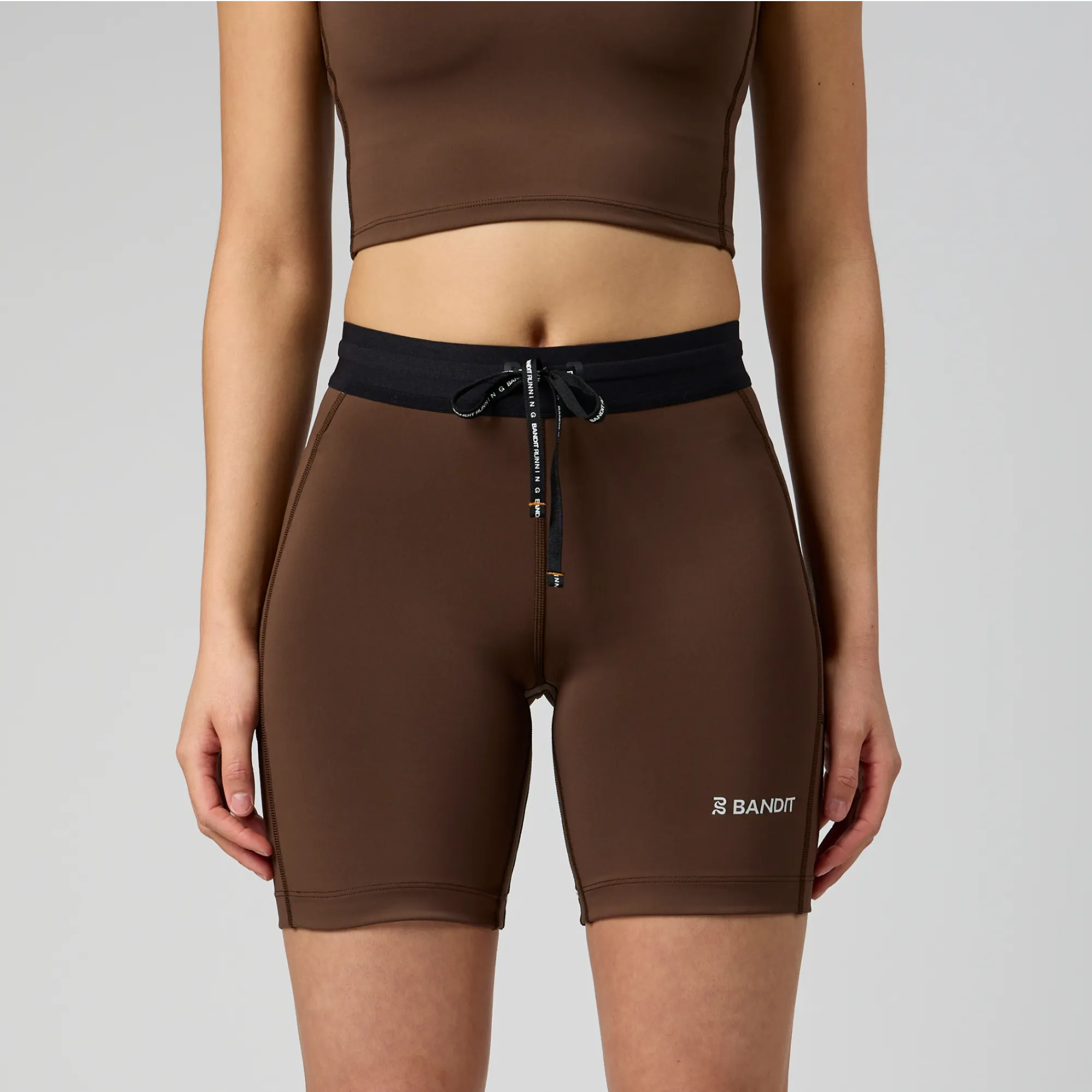 Stamina™ 7" Women's Compression Shorts - Umber sold by Bandit Running