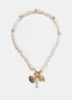 Gold Tone Shell Charm Necklace sold by Mint Velvet