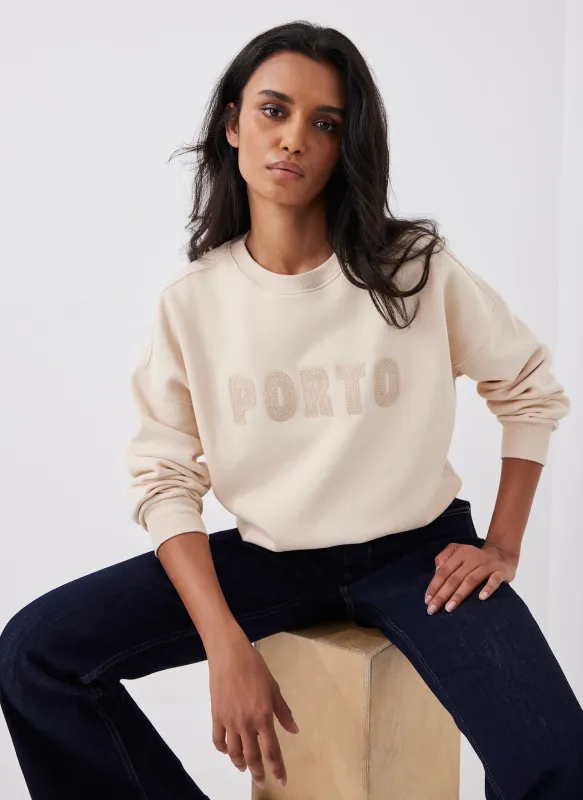 Neutral Porto Slogan Sweatshirt sold by Mint Velvet
