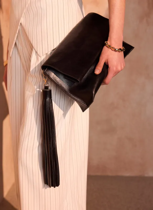 Daisy Black Leather Fold Over Tassel Clutch made by Mint Velvet