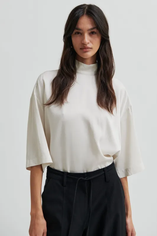 Twist Tee sold by Second Female