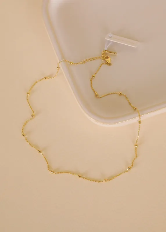 Gold Ball Necklace sold by JaxKelly