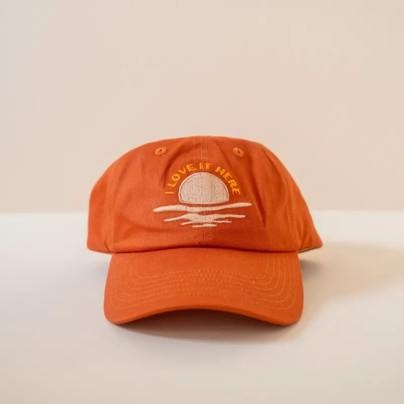 I love it here cap sold by Cai & Jo