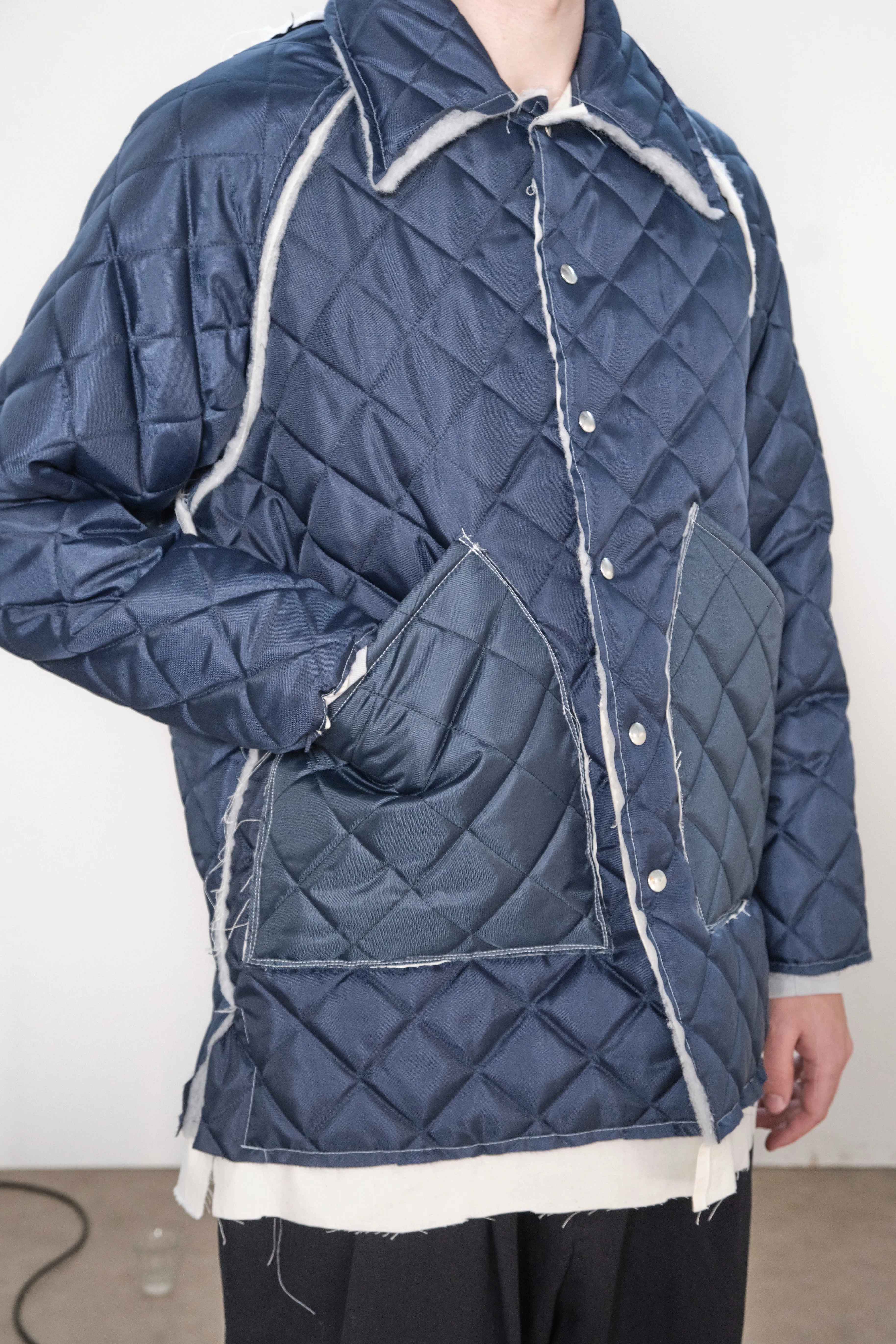 ONE OFF QUILTED COACH JACKET navy sold by Camiel Fortgens