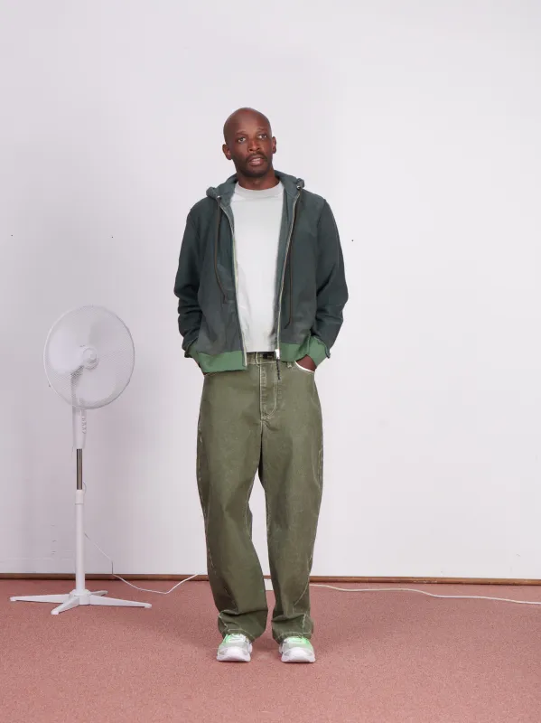 CF.23.15.03.01 WOBBLY JEANS coated denim green made by Camiel Fortgens