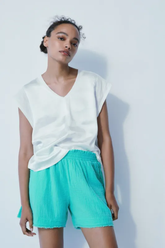 Cameron off white satin top sold by MELISSA NEPTON