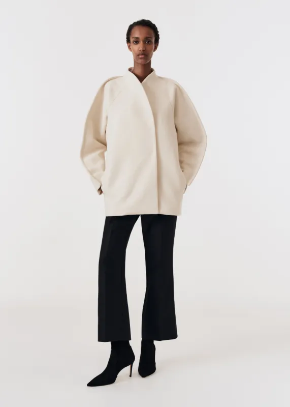 Curved seam coat sold by Bite Studios