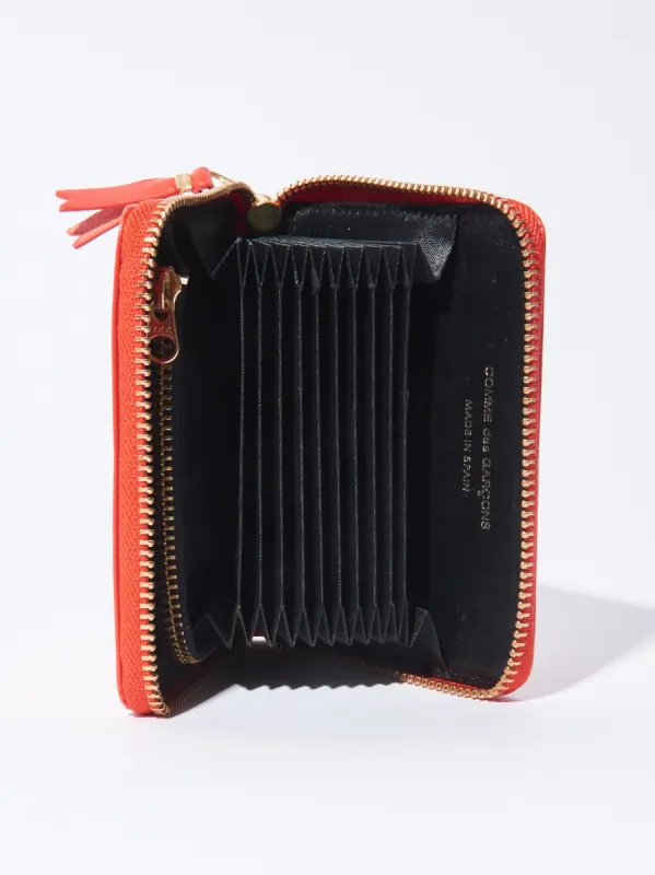 Orange Zip Around Wallet made by Comme des Garcons