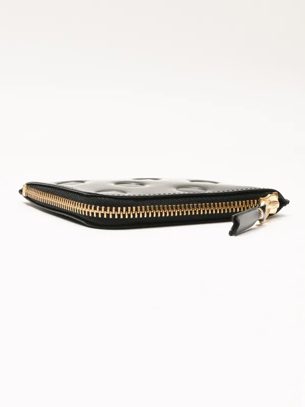 Black Embossed Polka Dots Half Zip Wallet sold by Frances May Houseline